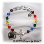 Designs by Debi handmade Rainbow Bridge Pet Memorial bracelet in sterling silver with the name Dawn in alphabet letter cubes, red, orange, yellow, green, blue, purple, crystal and crystal AB Swarovski crystals, a heart toggle, a paw print charm and a heart shape picture frame charm.