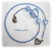 Handmade thong style bookmark in light blue with glass foil heart beads, seed beads, Swarovski crystal bicones, a heart charm and a charm reading Follow your Heart.