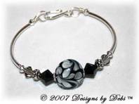 Designs by Debi Handmade Jewelry Black, Gray and White Swirled Lentil Glass Focal Bead and Swarovski Crystal Jet and Black Diamond Bicones Silver Fitted Bangle Bracelet with Hook Clasp