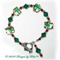 Designs by Debi Handmade Jewelry Red and Green Glass Present / Gift Beads, Swarovski Crystal Siam Red and Emerald Green Bicones and Silver Bracelet with a Square Silver and Crystal Toggle Clasp