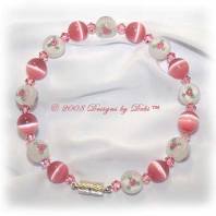 Designs by Debi Handmade Jewelry Pink Cat's Eye, Swarovski Crystal Light Rose Pink Bicones and White Glass Beads with Rosebuds Bangle Style Memory Wire Bracelet with Silver Magnetic Clasp