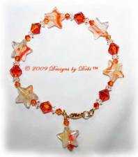 Designs by Debi Handmade Jewelry Orange and White Glass Stars and Swarovski Crystal Fire Opal Bicones and Crystal Spacers Bracelet with a Gold Lobster Clasp