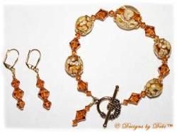 Designs by Debi Handmade Jewelry Aloha Collection Topaz Gold Bracelet and Earrings Set. Features topaz gold lentil and round aloha floral beads, gold bead caps, swarovski crystal topaz bicones, a gold floral toggle clasp and matching earrings.