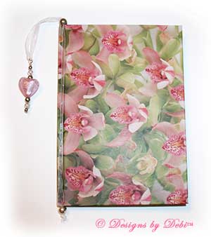 Sample photo of a Designs by Debi Handmade Jewelry ribbon slide style bookmark in use