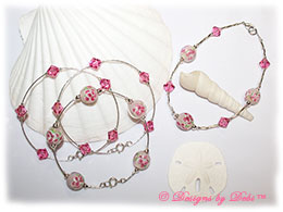 Designs by Debi Handmade Jewelry Aloha Collection  Bangle Trio and Anklet Set. Features a trio of silver bangles with pink aloha floral beads and swarovski crystal rose bicones and a matching anklet.