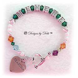 Designs by Debi Handmade Jewelry Personalized Generations Keepsake Bracelet in the Karen Style Twist and Stardust bead combination (altered for a very small wrist) with every family member's birthstone, a heart toggle clasp and Grandma heart charm. Grandmother's or Nana's Bracelet