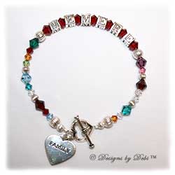 Designs by Debi Handmade Jewelry Generations Keepsake Bracelet in the Karen Style Corrugated bead combination with every family member's birthstone, a heart toggle and Family heart charm. Grandmother's or Nana's Bracelet